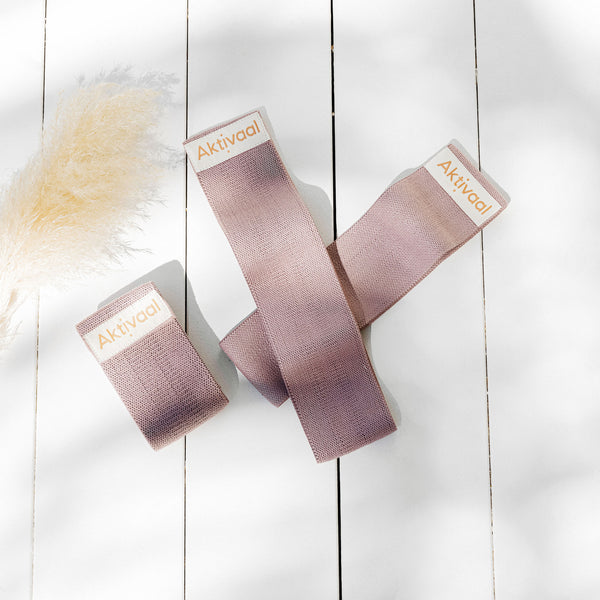 Close up of three pink loop bands.