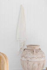 Turkish towel hanging from hook.