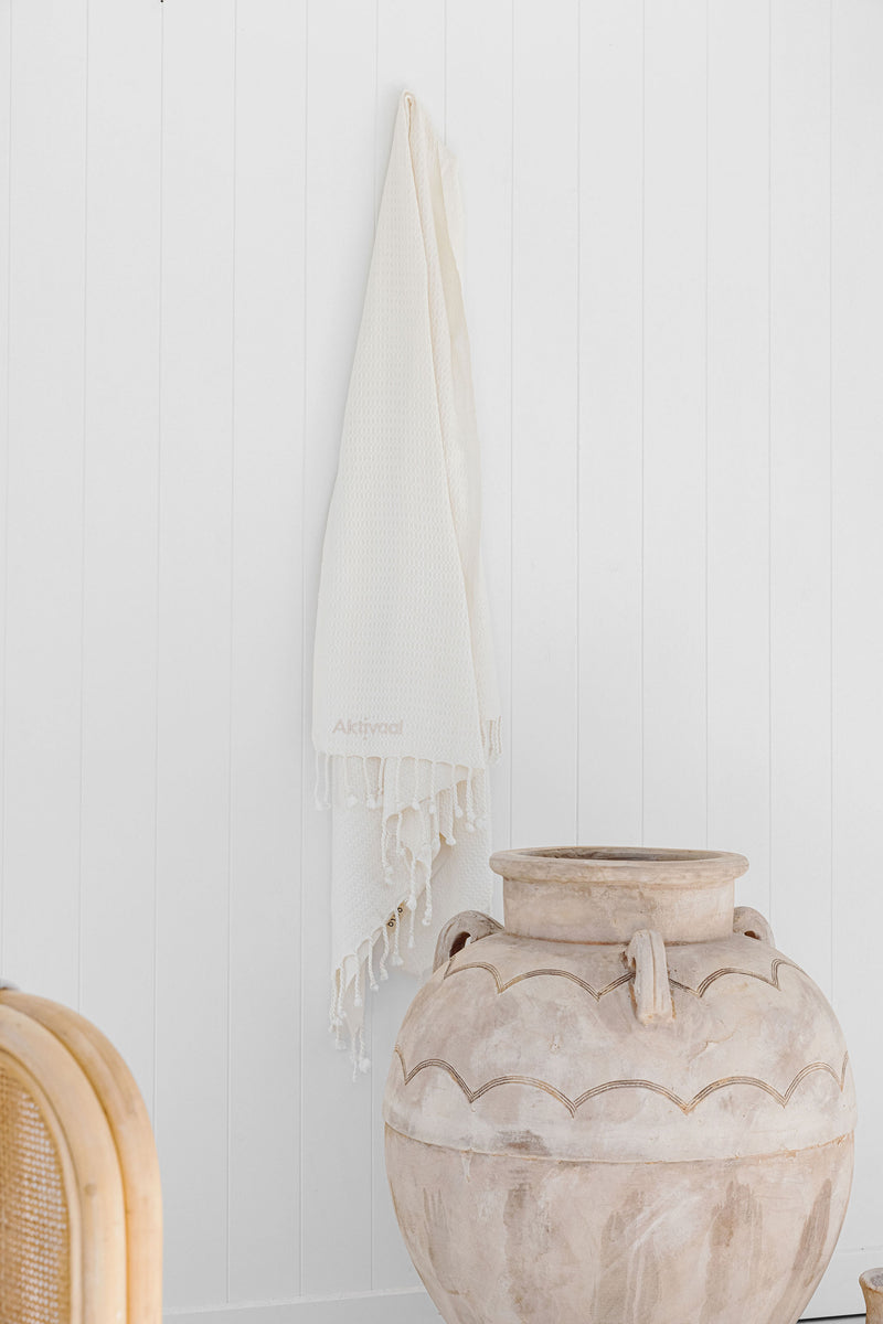 Turkish towel hanging from hook.